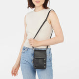 Black Hammitt VIP Mobile purse with sleek design and gold-tone hardware, featuring a compact, stylish accessory for essentials.