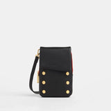 Black Hammitt VIP Mobile purse with brushed gold accents and red zip, featuring a sleek, compact design for stylish carrying.