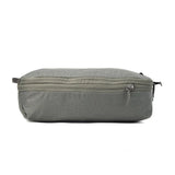 Charcoal medium Peak Design packing cubes from Index Urban for organized travel storage, showing multiple stacked cubes.