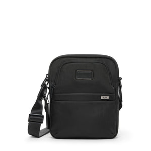 Tumi Alpha medium crossbody bag in urban style with adjustable strap and multiple compartments, designed for everyday use.