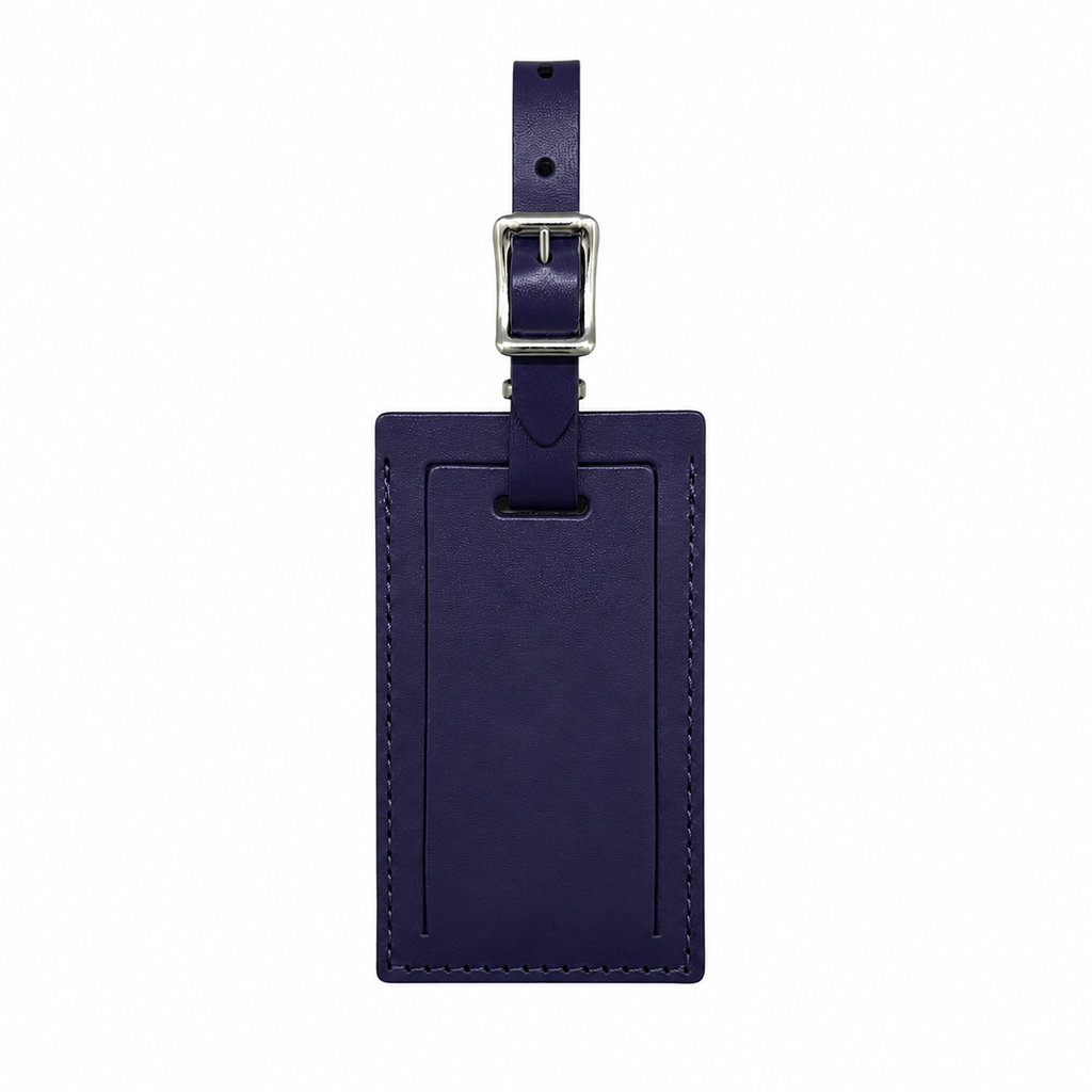 Personalized leather luggage tag by Index Urban, made in the USA, featuring a sleek design for travel identification.