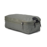 Small Peak Design Packing Cube from Index Urban, shown in neutral color, with multiple compartments for organized travel storage.
