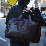 Jack Georges classic leather duffel bag with sturdy handles and spacious main compartment, ideal for travel and weekend trips.