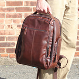 Brown Jack Georges mid-size tech backpack with multiple compartments and padded straps, ideal for work or travel.