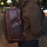 Brown Jack Georges mid-size tech backpack with multiple compartments and padded shoulder straps, designed for daily use and organization.