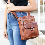 Brown Jack Georges Voyager Collection crossbody bag with adjustable strap and multiple compartments, made of premium leather.