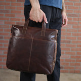 Jack Georges Voyager Collection North / South Tote in black leather, showing the spacious interior and sturdy handles.
