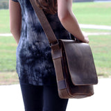 Jack Georges Arizona Crossbody Messenger Bag showing brown leather exterior and adjustable strap on a plain background
