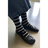 Black Le Bon Shoppe Wally Socks featuring bold stripe patterns and comfortable knit fabric, perfect for casual wear.