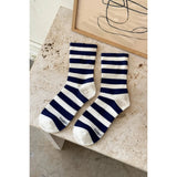 Black Le Bon Shoppe Wally Socks featuring bold white stripe pattern and comfortable knit fabric.
