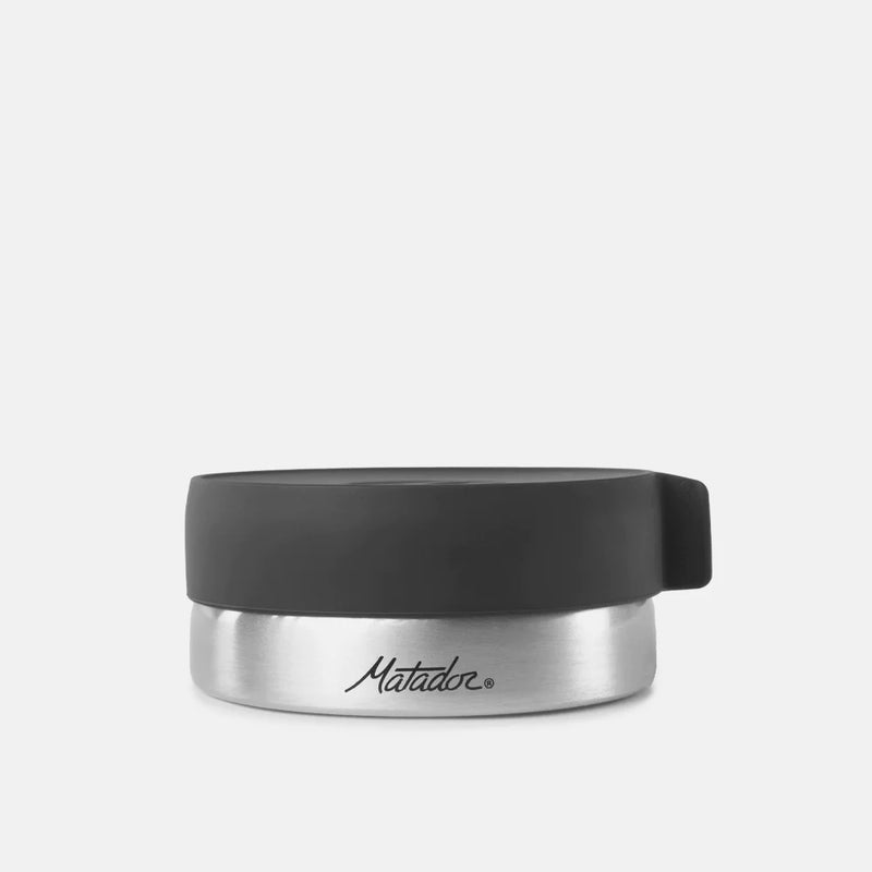 Matador waterproof travel canister in gray, 100ml size, showing durable, compact travel accessories container for liquids or essentials
