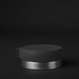 Matador waterproof travel canister 100ml, compact accessories container for liquids, with a black cap and clear body.