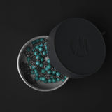 Matador waterproof travel canister 100ml accessory with secure lid, ideal for storing small travel essentials and jewelry.