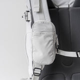 Matador Speed Stash accessories pouch in white fabric with zipper and branding, designed for compact storage and easy access.