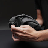 Charcoal Matador Nanodry packable beach towel, lightweight and quick-drying accessory perfect for travel and beach outings.