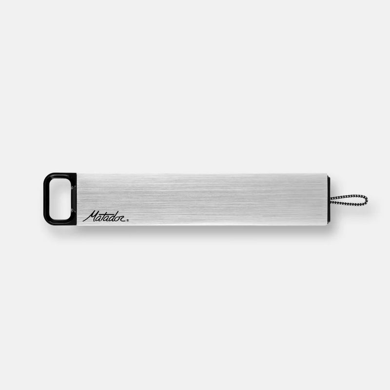 Matador waterproof pill canister in gray with secure screw-top lid, compact travel accessory for medication storage.