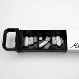 Matador waterproof pill canister accessory shown with white background, compact design, and secure screw-top lid for outdoor use