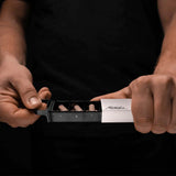 Matador waterproof pill canister accessory with compact, durable design, featuring a secure screw-top lid for outdoor use.
