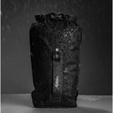 Black Matador Flatpak Dry Bag 2L with roll-top closure, designed for waterproof storage and outdoor adventures.