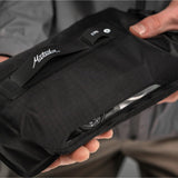 Black Matador Flatpak Dry Bag 2L shown with secure roll-top closure and compact design for waterproof storage.