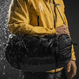 Matador Freefly 30L packable duffle bag made of durable fabric, shown folded and partially expanded for travel and storage.