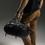 Matador Freefly 30L packable duffle bag shown folded and unfolded, lightweight and durable travel gear for easy storage and transport.