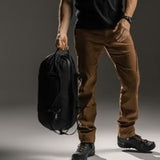 Matador Freefly 30L packable duffle bag made of durable material, shown folded and partially expanded for travel and storage.
