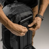 Matador Freefly 30L packable duffle bag in black, showing compact design with shoulder straps and spacious main compartment.