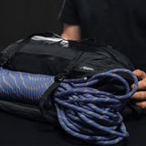 Matador Freefly 30L packable duffle bag in black, showing compact design and sturdy handles for travel and storage.
