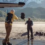 Matador Freefly 30L packable duffle bag in black, showing compact design with zipper closure and adjustable shoulder strap.