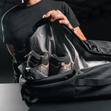 Matador SEG45 Travel Pack in dark gray, shown open with multiple compartments and packing cubes for organized travel storage.