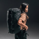 Matador SEG45 Travel Pack shown in black with multiple compartments and adjustable straps, designed for compact travel and organization.