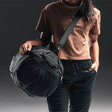 Matador SEG45 Travel Pack duffle bag in black with adjustable shoulder strap and multiple zippered compartments.