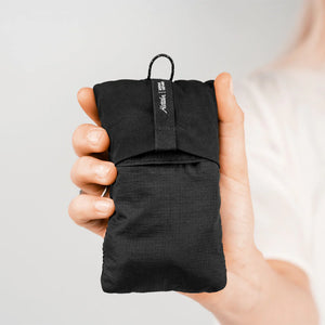 Matador blackout sleep mask with adjustable strap and earplugs for blocking light and noise during sleep.