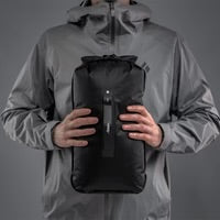 Matador Flatpak Dry Bag 8L in black, waterproof outdoor gear for keeping belongings dry during adventures.