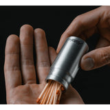 Matador waterproof travel canister in 40ml, compact and durable for storing liquids during travel, shown in the image.