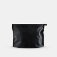 Matador Flatpak zipper toiletry case in black with compact design and secure zipper closure, ideal for travel organization.