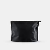 Matador Flatpak zipper toiletry case in black with compact design and secure zipper closure, ideal for travel organization.