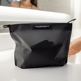 Matador Flatpak zipper toiletry case with compact design and durable fabric, ideal for travel organization.