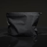Matador Flatpak zipper toiletry case with sleek black design and compact, durable storage for travel essentials.