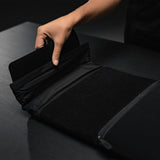 Matador laptop base layer case in black with sleek design, made for protecting and carrying laptops securely.