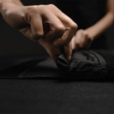 Matador laptop base layer case in black, showing a sleek protective cover designed for laptops with durable material and minimal branding.
