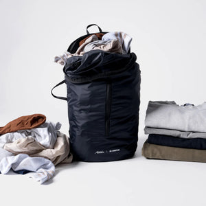 Black Matador packable laundry bag with drawstring closure, lightweight and foldable for easy storage and transport.