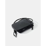 Black Matador Global Travel Stash for packing organization, with multiple zippered compartments and compact design for travel storage.