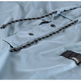 Matador Nanodry packable towel poncho in slate blue, lightweight, quick-drying, and versatile for outdoor use