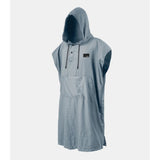 Slate blue Matador Nanodry packable towel poncho laid flat, showing its lightweight, quick-drying fabric and adjustable hood.