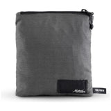 Slate blue Matador Nanodry packable towel poncho spread out, showing its lightweight, quick-drying fabric and casual fit.