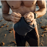Matador Nanodry packable towel poncho in slate blue, lightweight and quick-drying for outdoor activities and travel.