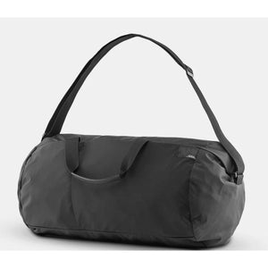 Matador Refraction packable duffle bag in vibrant color, showing its compact design and durable material for travel and storage.