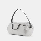 Matador Refraction packable duffle bag in sleek design, shown folded and expanded for travel and storage.